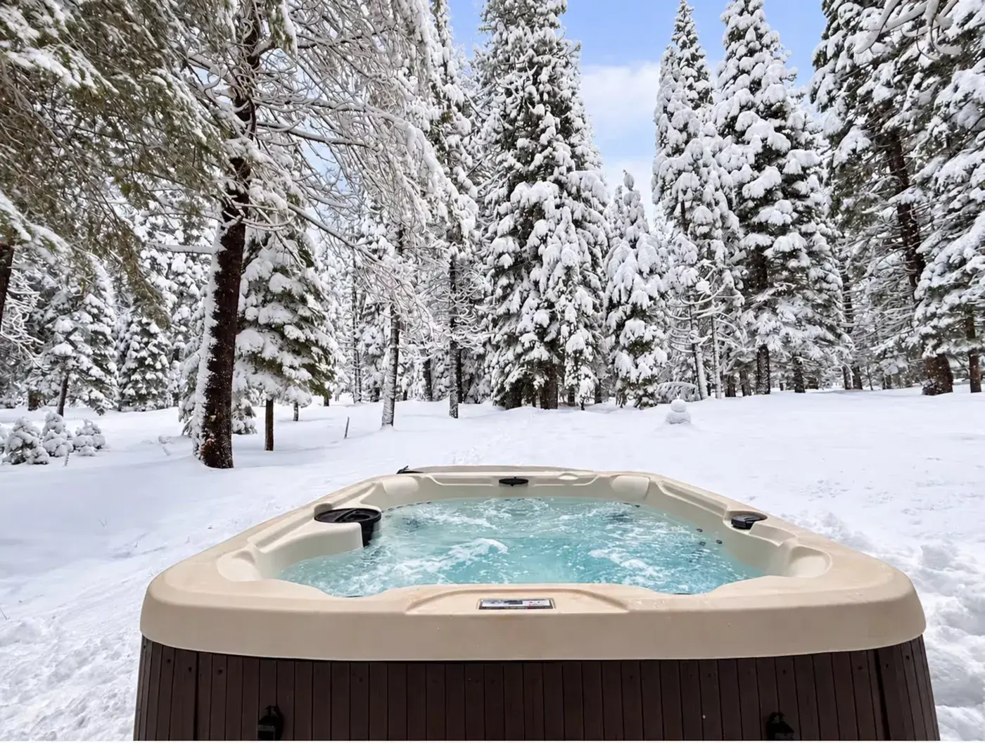 Hot tub at a short-term rental M&P operates, in fresh snow
